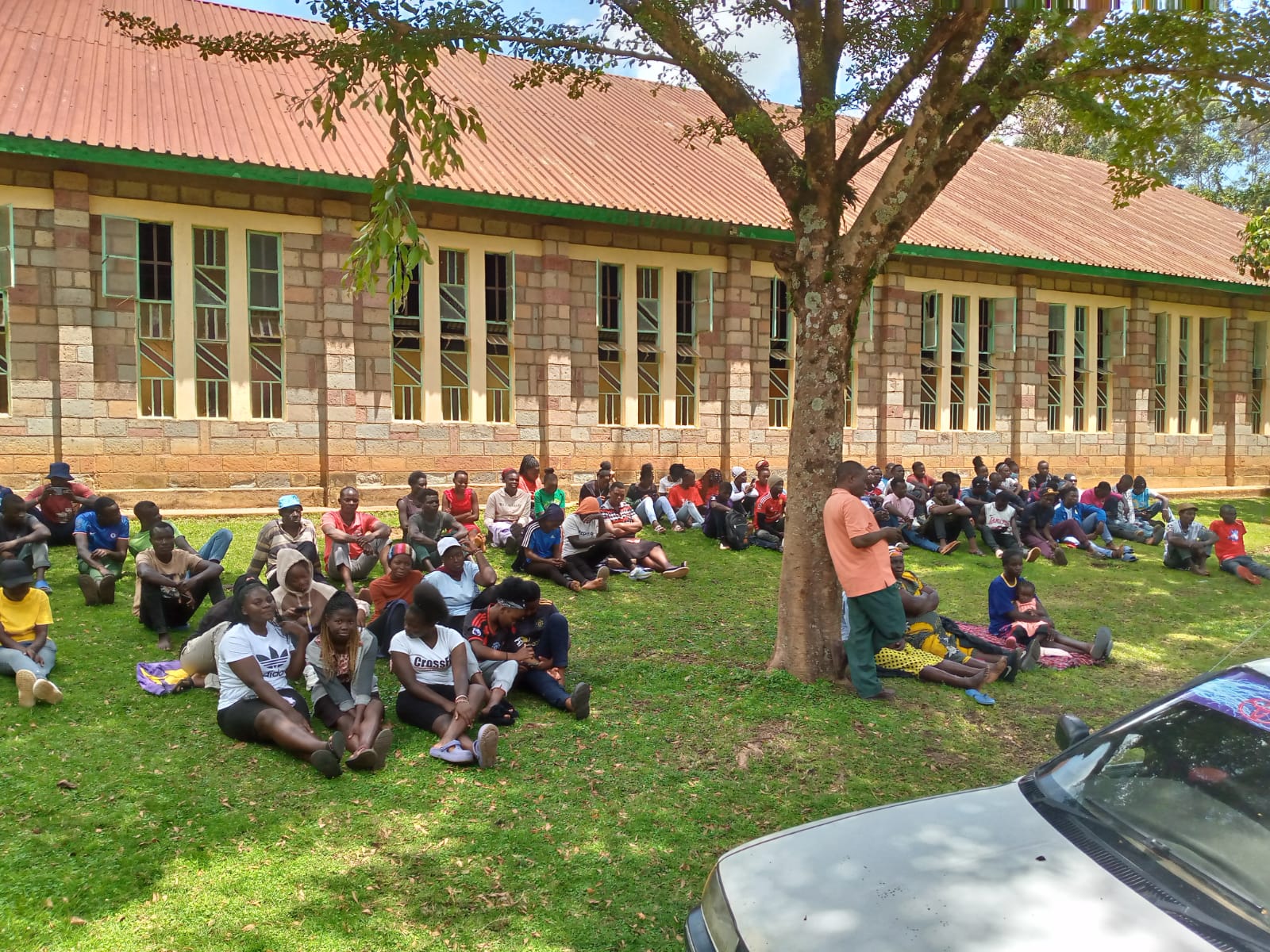 Students gathered outdoors on the Emgwen TVC campus lawn.