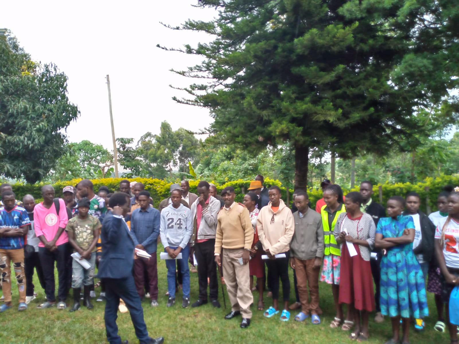 Emgwen TVC outreach team and learners standing outdoors together for a group photograph.