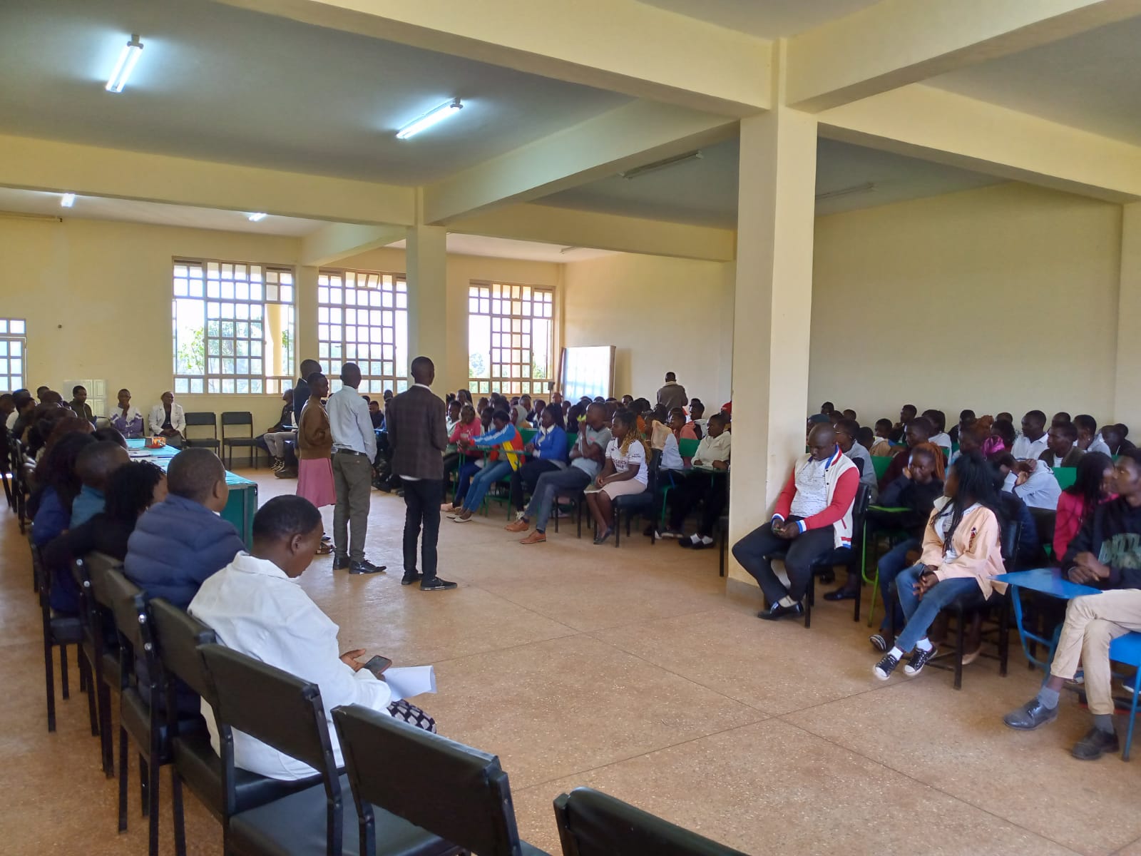Students seated inside an Emgwen TVC hall during a student orientation programme.